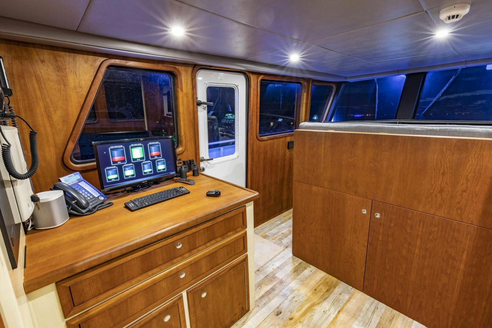 a computer on a desk aboard RESET Yacht for Sale