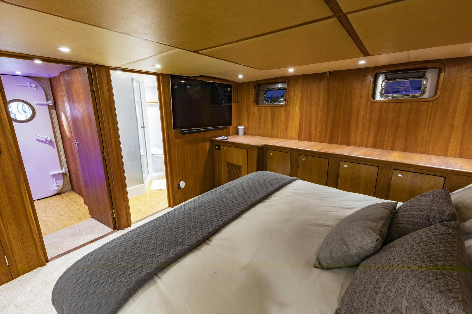 a bed in a room aboard RESET Yacht for Sale