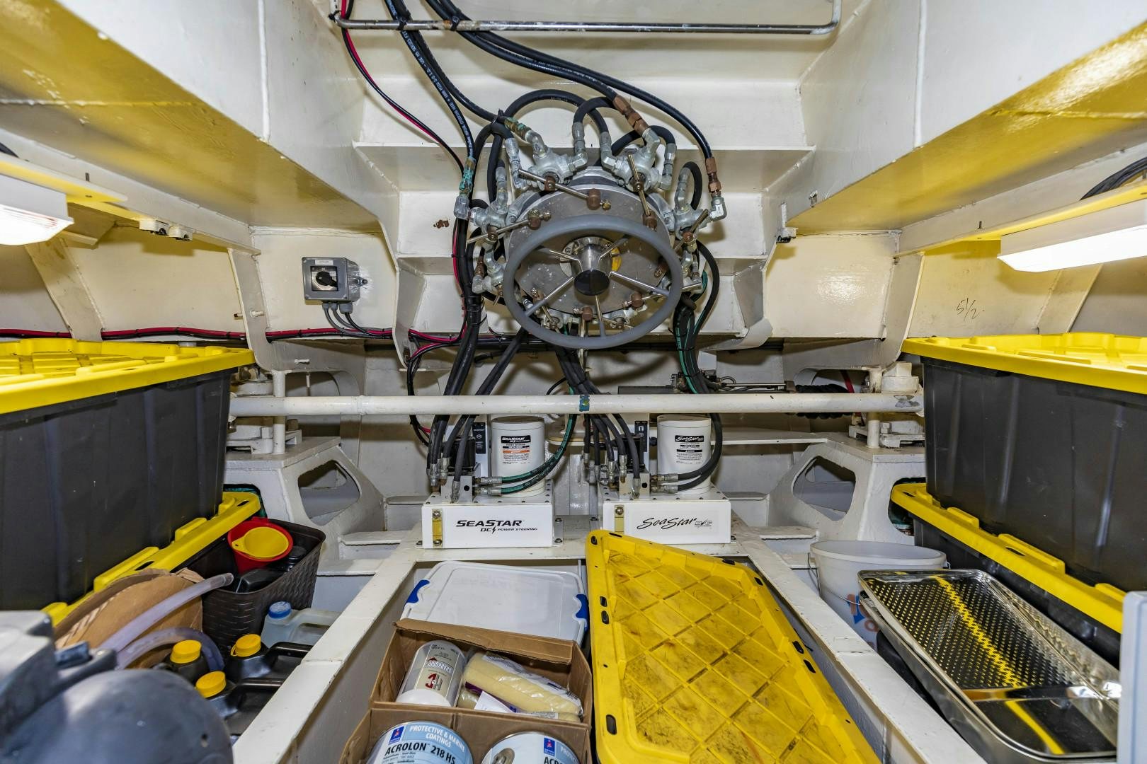 a large room with a fan and boxes aboard RESET Yacht for Sale