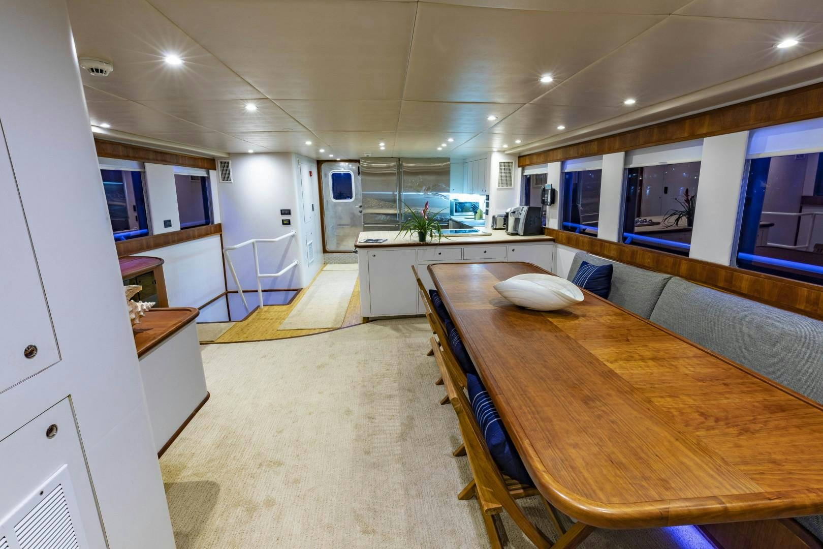 a kitchen and dining area aboard RESET Yacht for Sale
