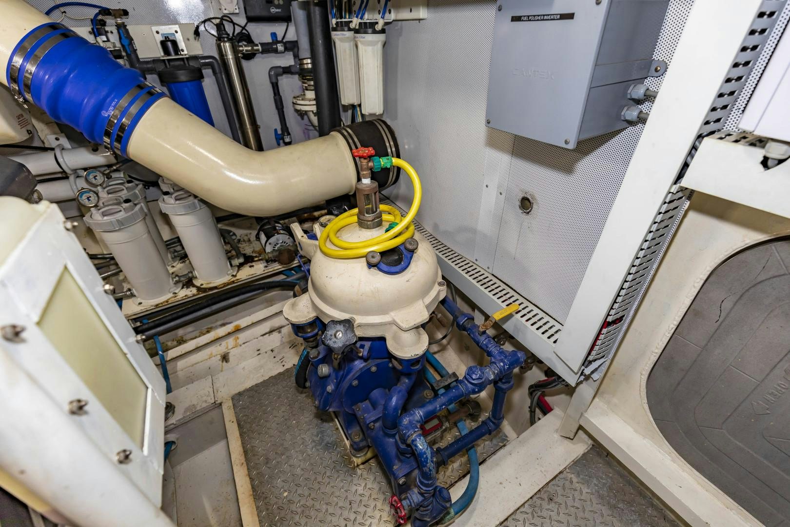 a machine with a blue and yellow pipe aboard RESET Yacht for Sale