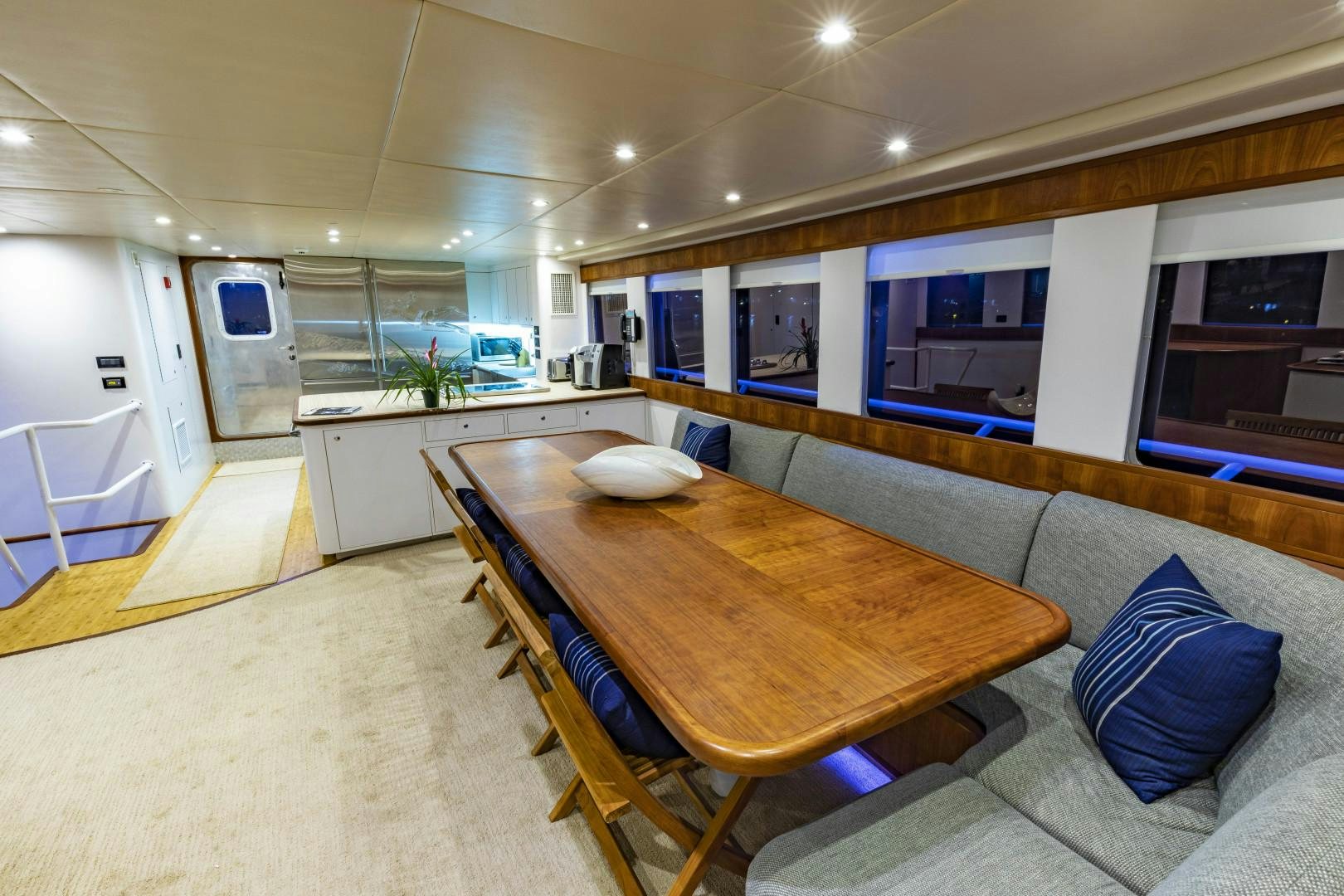 a large kitchen and dining room aboard RESET Yacht for Sale