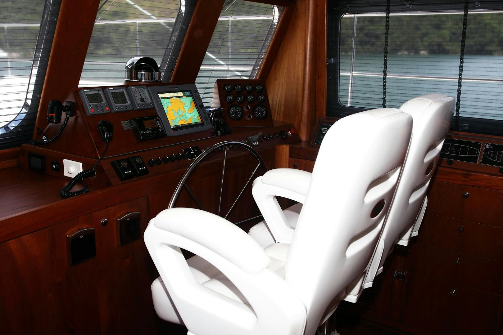 a white chair in a room aboard MESTRE BELO Yacht for Sale