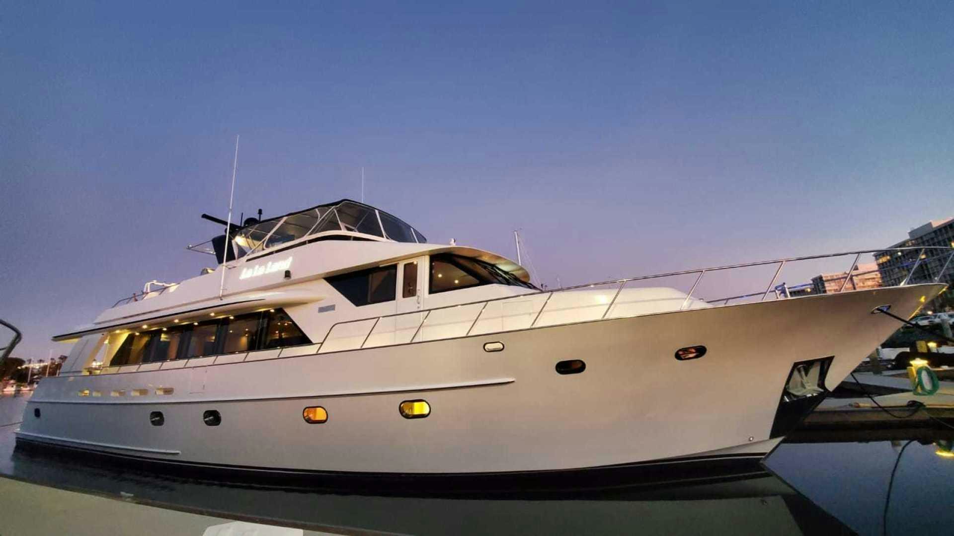 a white yacht with a blue sky aboard LA LA LAND Yacht for Sale