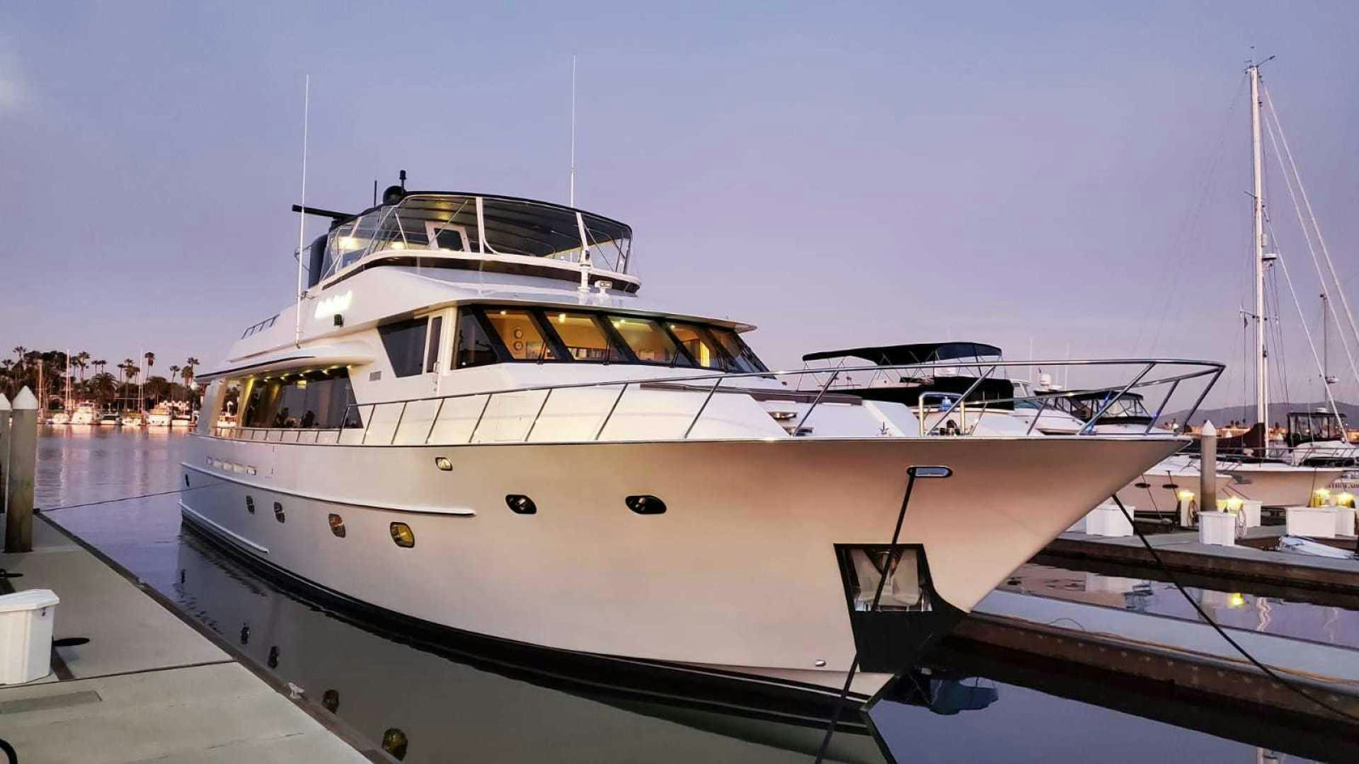 a white yacht in a dock aboard LA LA LAND Yacht for Sale