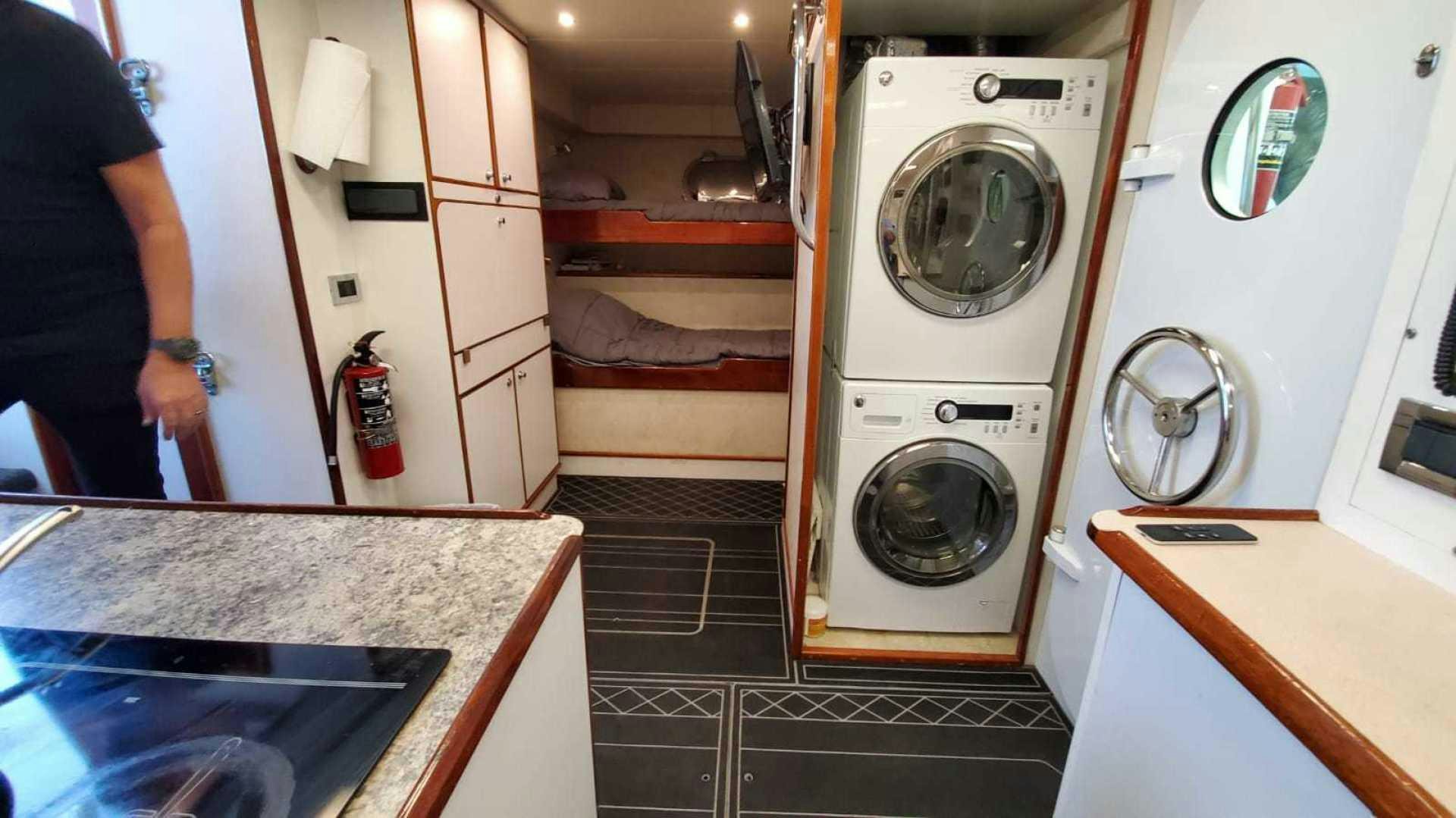 a room with a washing machine and a sink aboard LA LA LAND Yacht for Sale