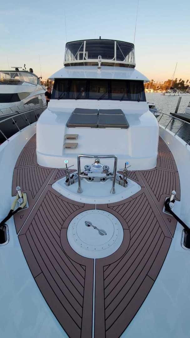 a boat with a clock on it aboard LA LA LAND Yacht for Sale