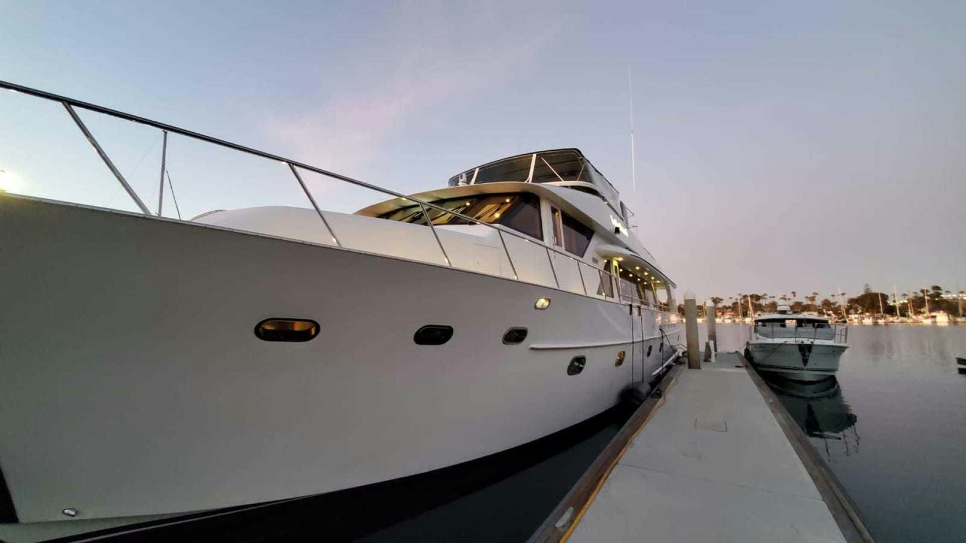 a boat docked at a pier aboard LA LA LAND Yacht for Sale