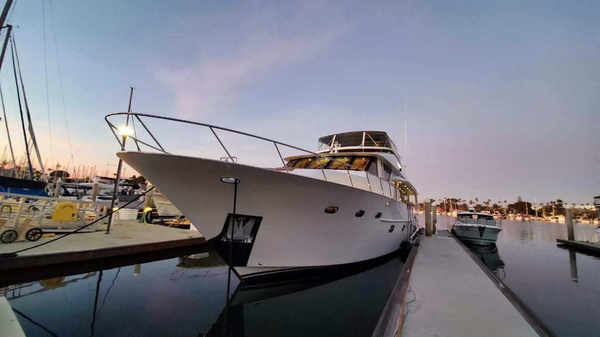 a boat docked at a pier aboard LA LA LAND Yacht for Sale