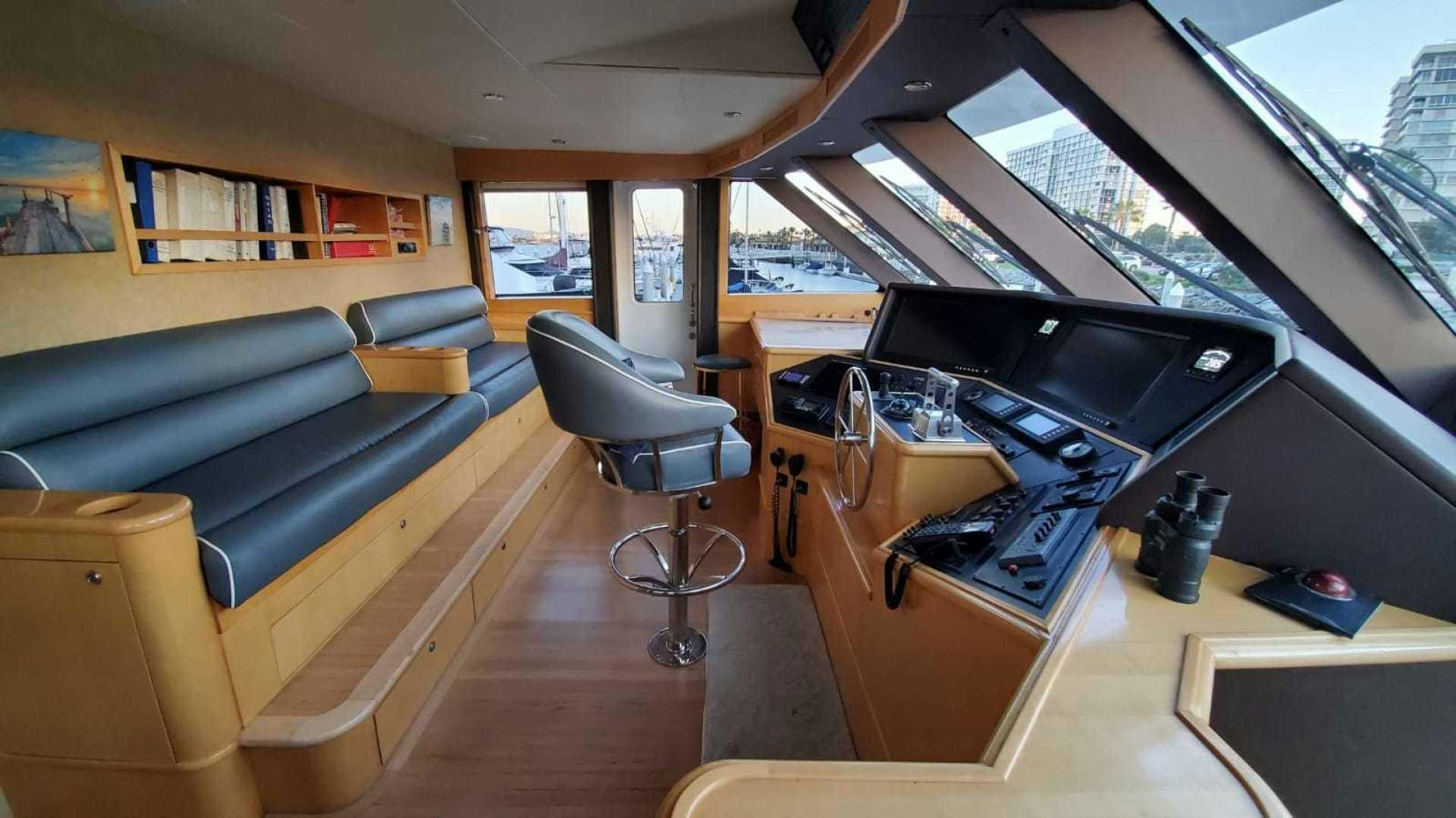 a room with a couch and a piano aboard LA LA LAND Yacht for Sale