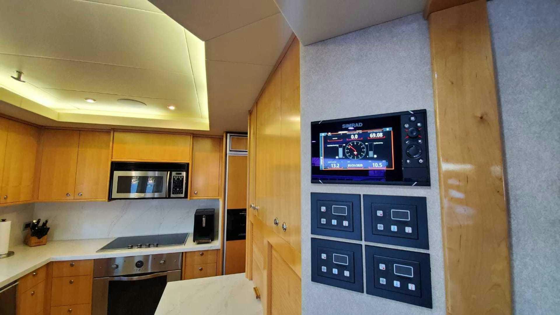 a kitchen with a microwave oven aboard LA LA LAND Yacht for Sale