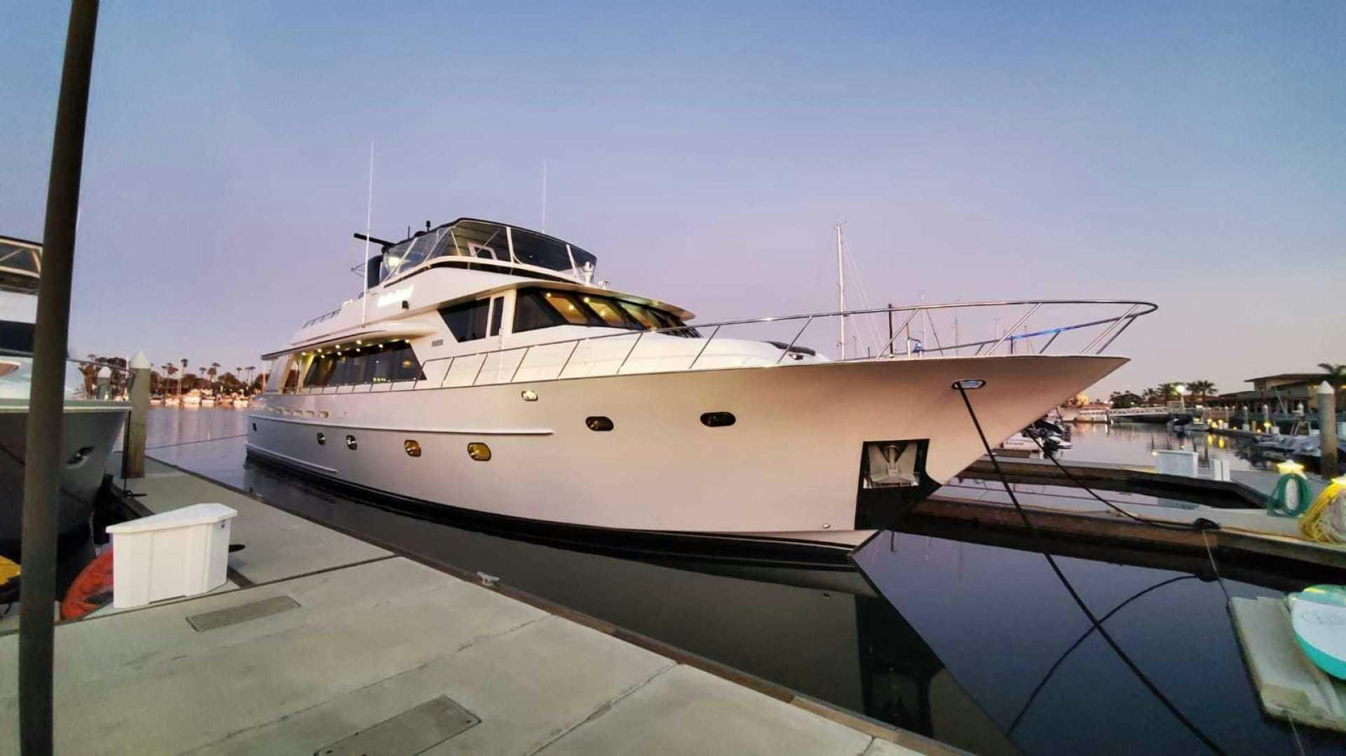 a boat docked at a pier aboard LA LA LAND Yacht for Sale