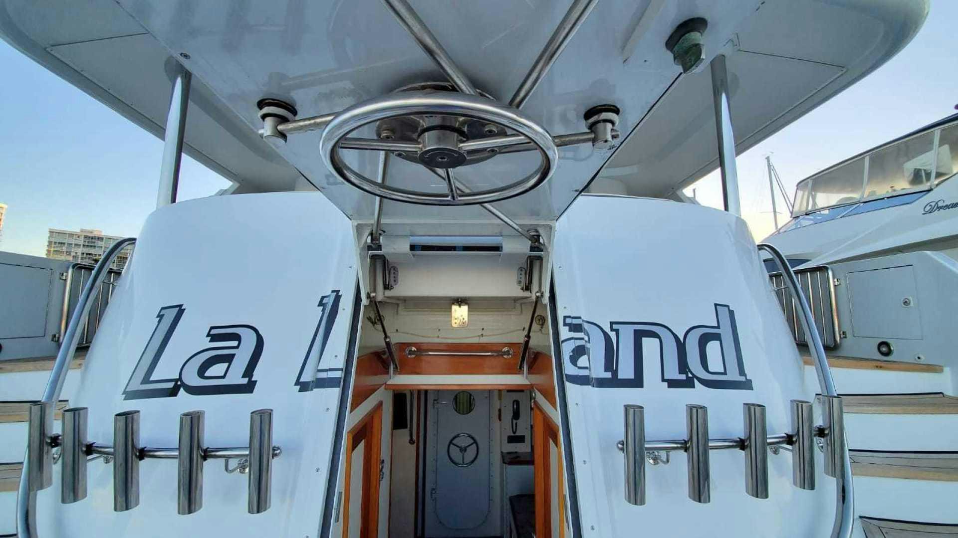 a close-up of a white vehicle aboard LA LA LAND Yacht for Sale