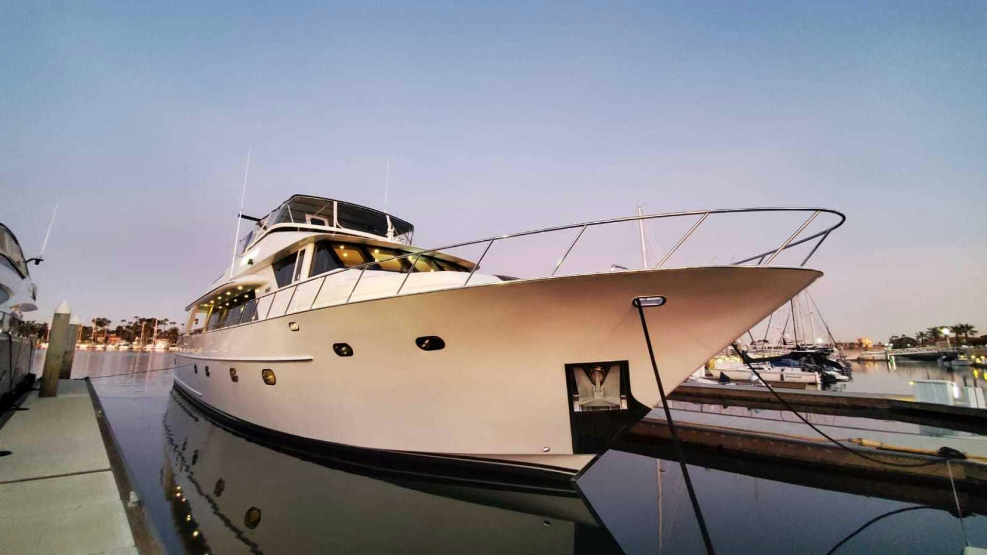 a boat docked at a pier aboard LA LA LAND Yacht for Sale