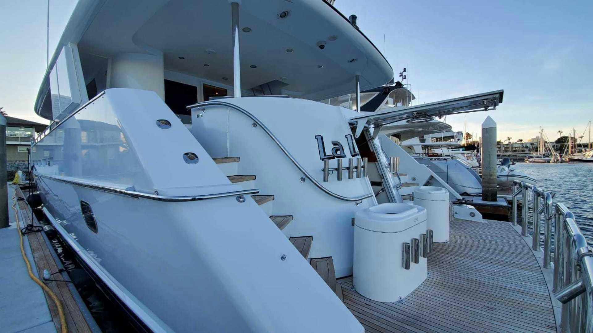 a boat docked at a pier aboard LA LA LAND Yacht for Sale