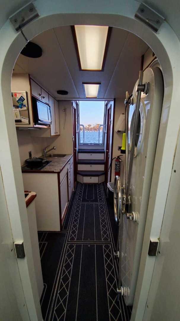 a long narrow hallway aboard LA LA LAND Yacht for Sale