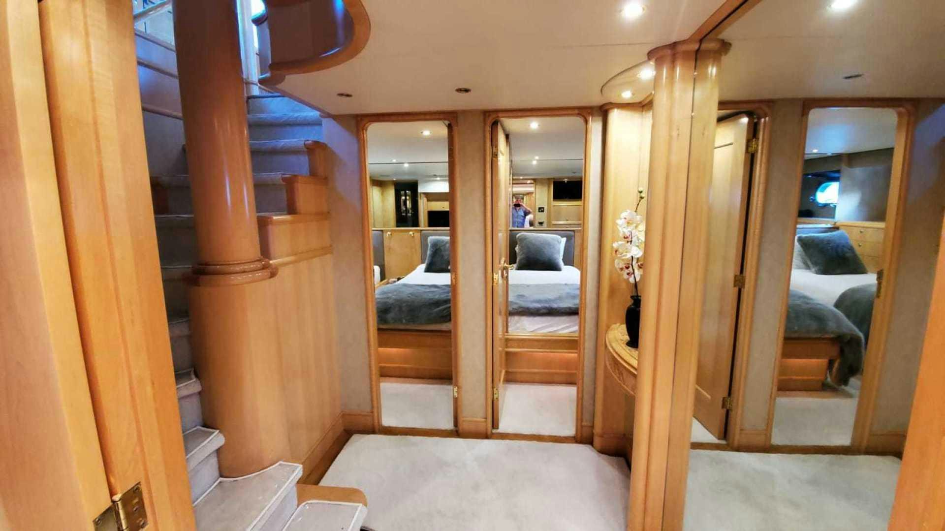 a room with wood walls and wood doors aboard LA LA LAND Yacht for Sale