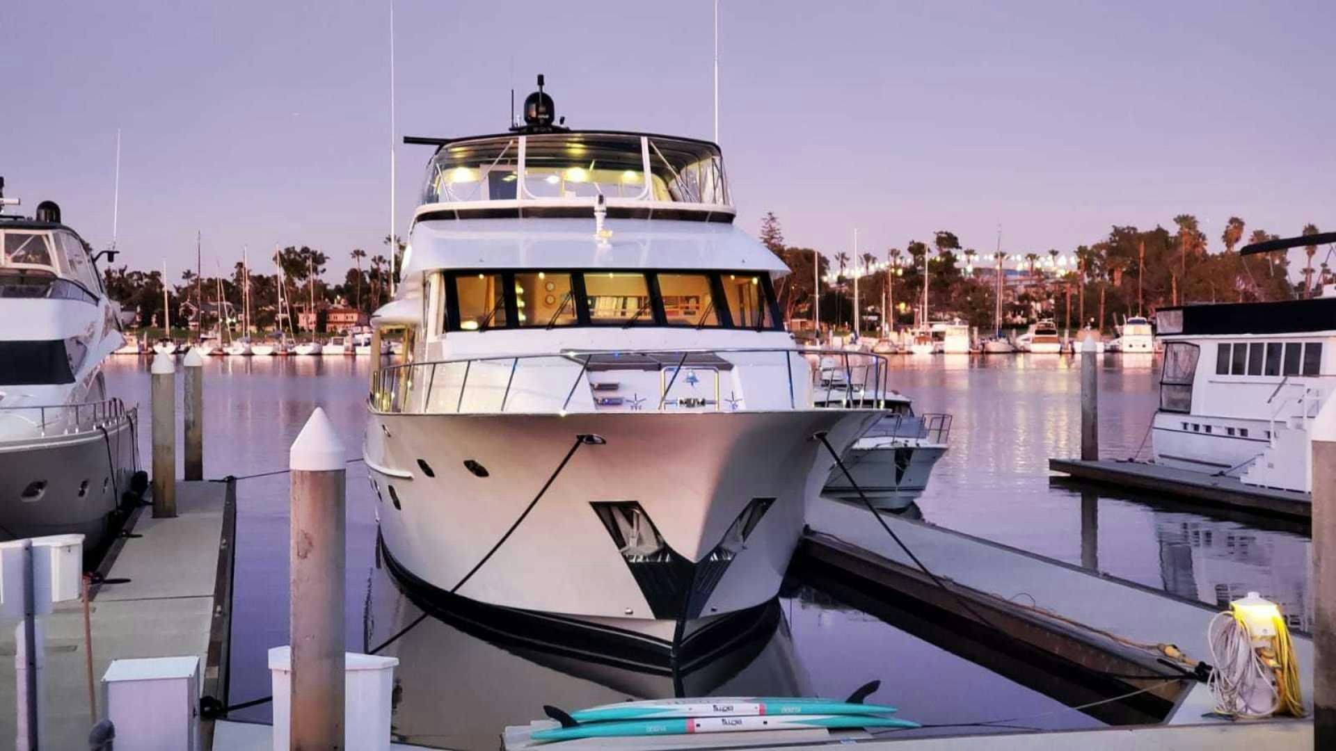 a boat docked at a pier aboard LA LA LAND Yacht for Sale