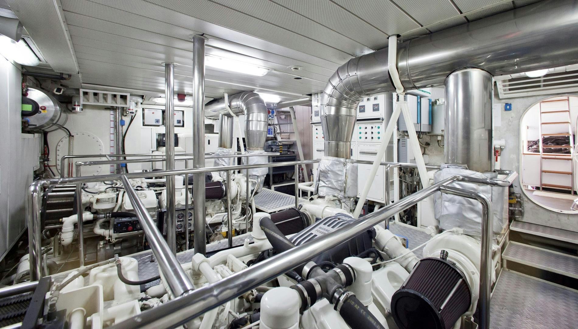 a large room with pipes aboard LADY MOH Yacht for Sale