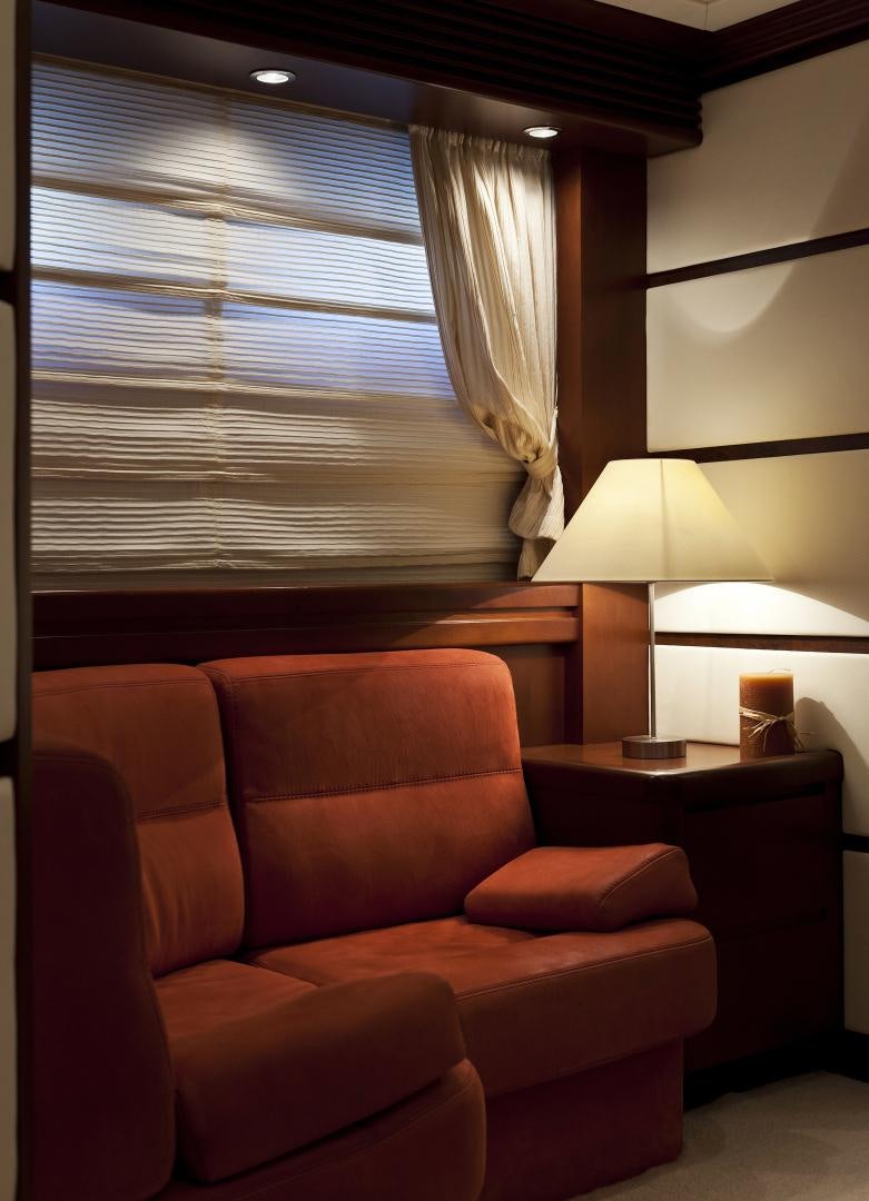 a couch and a lamp in a room aboard LADY MOH Yacht for Sale