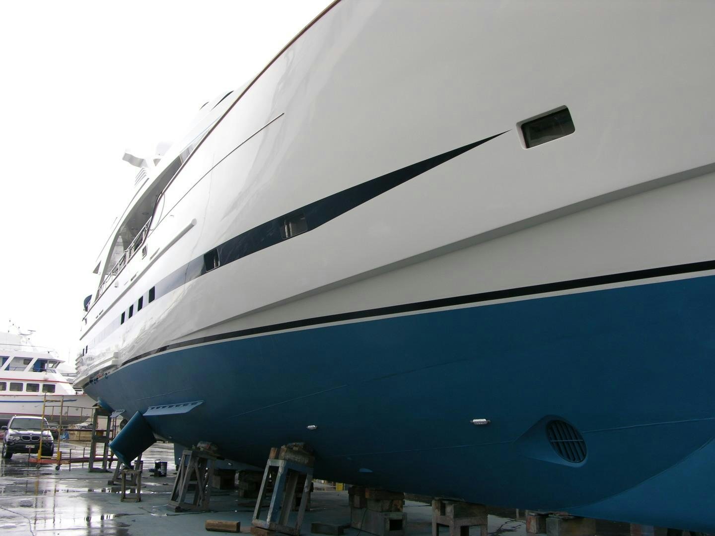 a large white and black airplane aboard LADY MOH Yacht for Sale