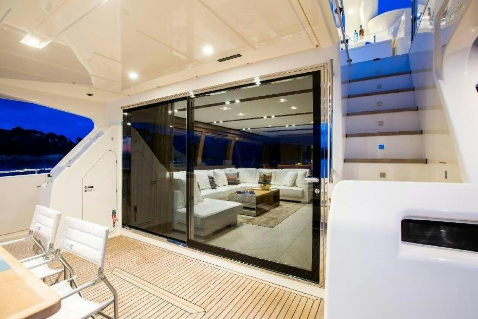 a room with a large glass door aboard HAPPY BLUE II Yacht for Sale