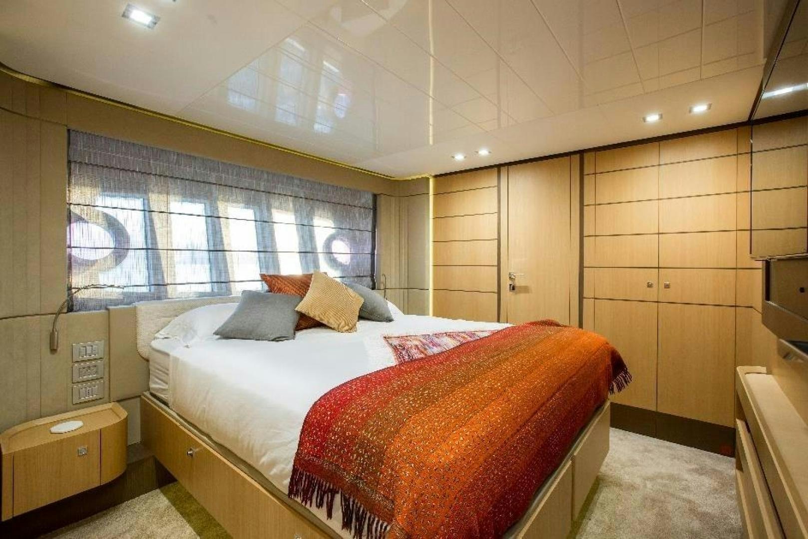 a bedroom with a bed aboard HAPPY BLUE II Yacht for Sale