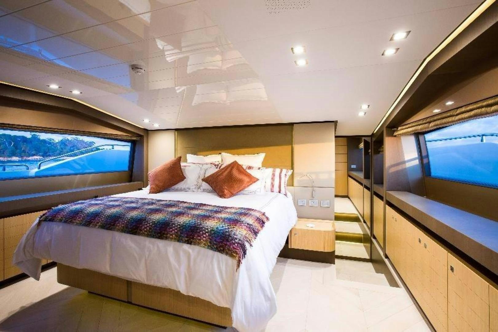 a room with a bed and a tv aboard HAPPY BLUE II Yacht for Sale