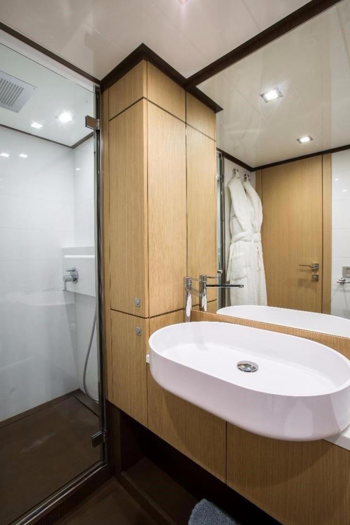 a bathroom with a sink and a mirror aboard HAPPY BLUE II Yacht for Sale