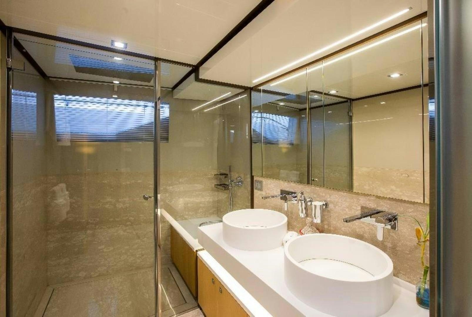 a bathroom with a large mirror aboard HAPPY BLUE II Yacht for Sale