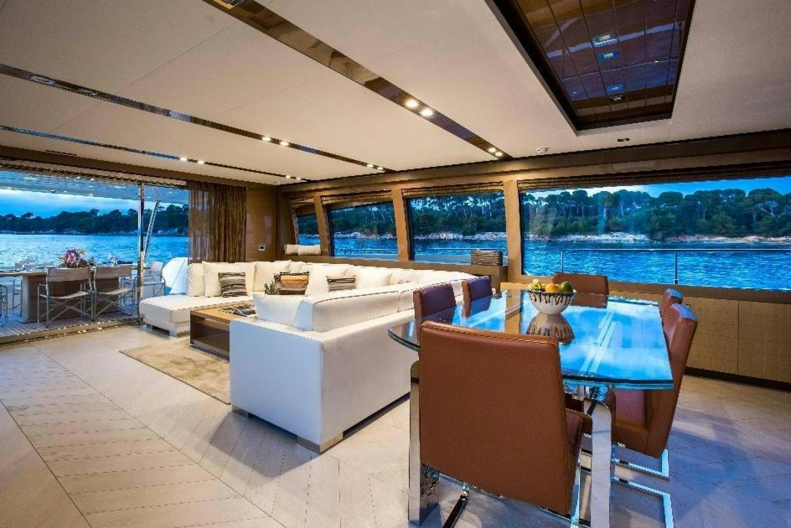 a living room with a large window aboard HAPPY BLUE II Yacht for Sale