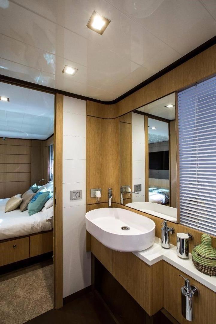 a bathroom with a large mirror aboard HAPPY BLUE II Yacht for Sale