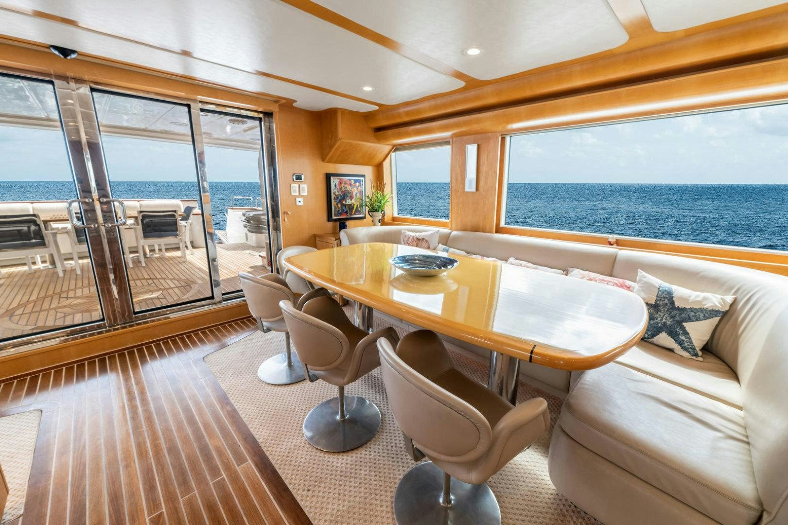 a living room with a large window aboard BERADA Yacht for Sale
