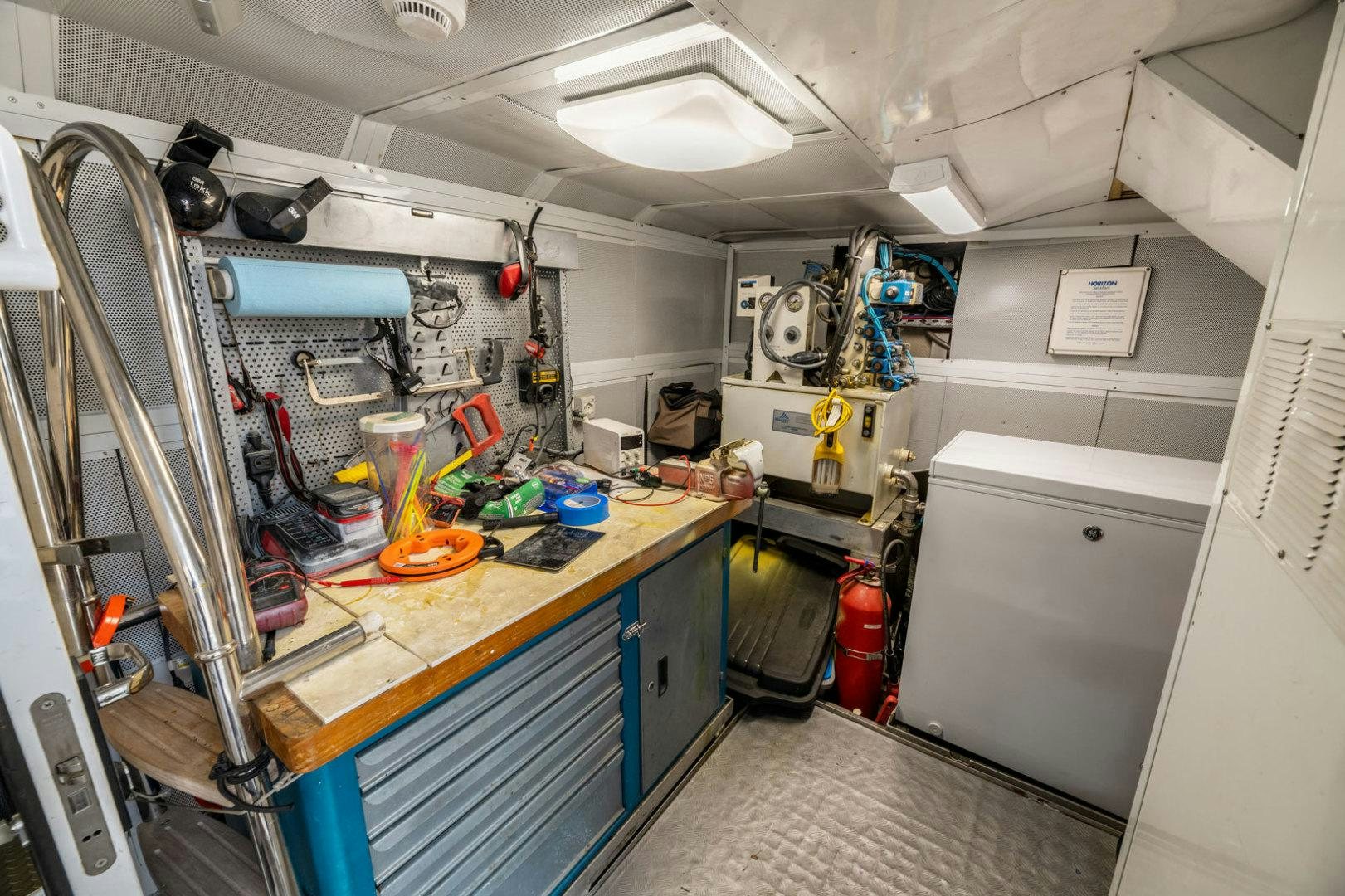 a kitchen with a lot of equipment aboard BERADA Yacht for Sale