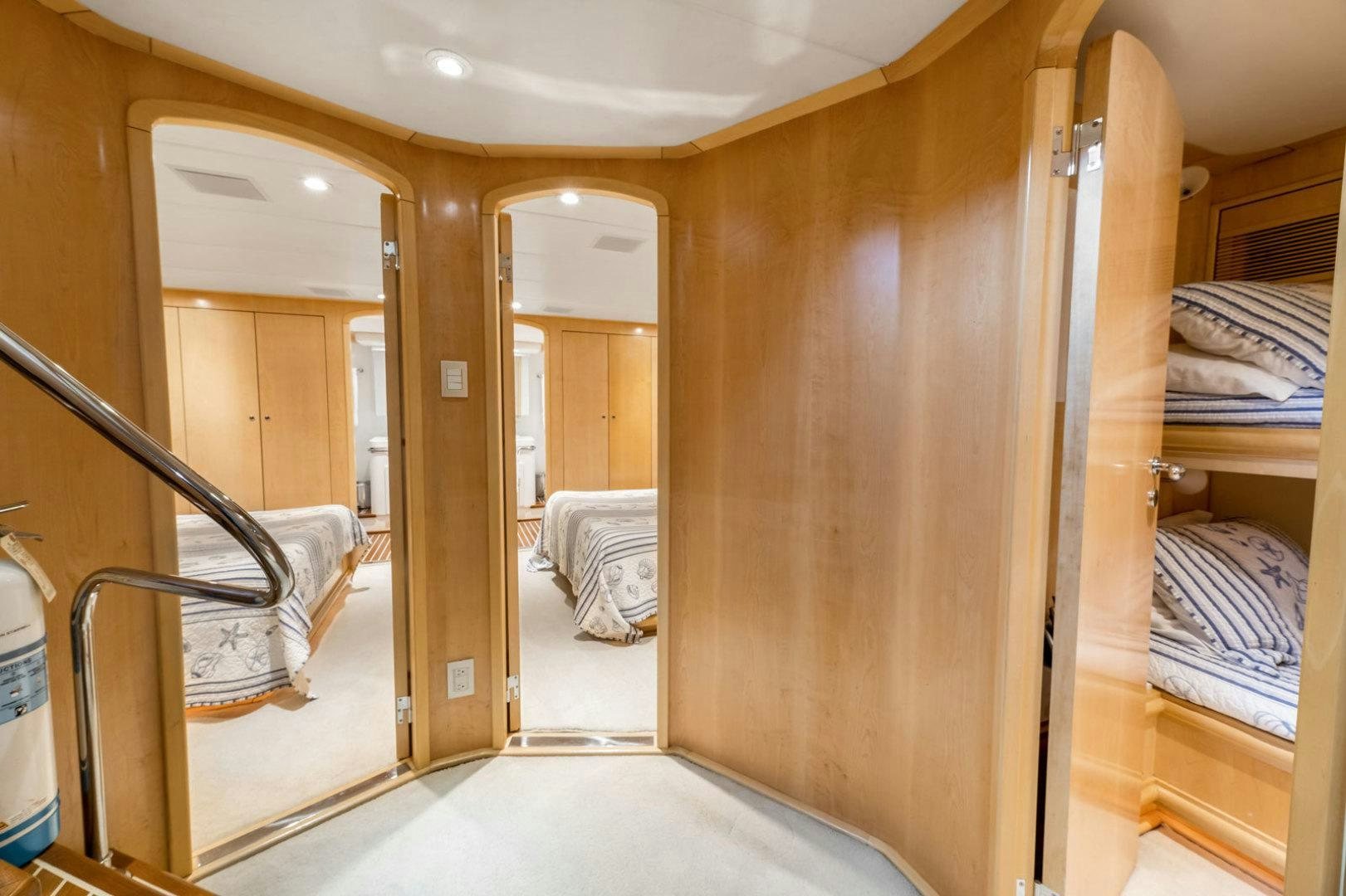 a room with a bunk bed and a ladder aboard BERADA Yacht for Sale