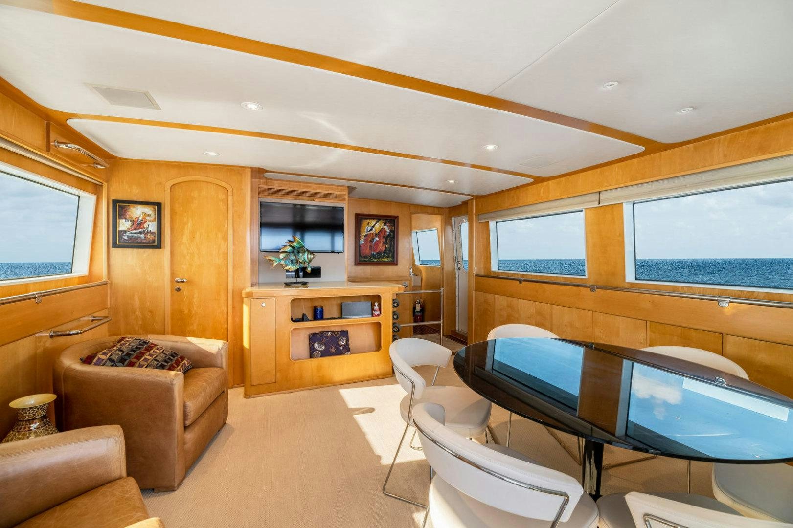 a living room with a large window aboard BERADA Yacht for Sale