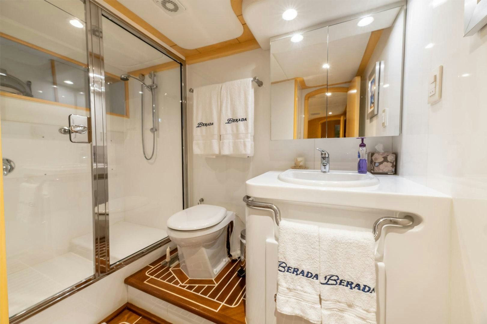 a bathroom with a standup shower aboard BERADA Yacht for Sale