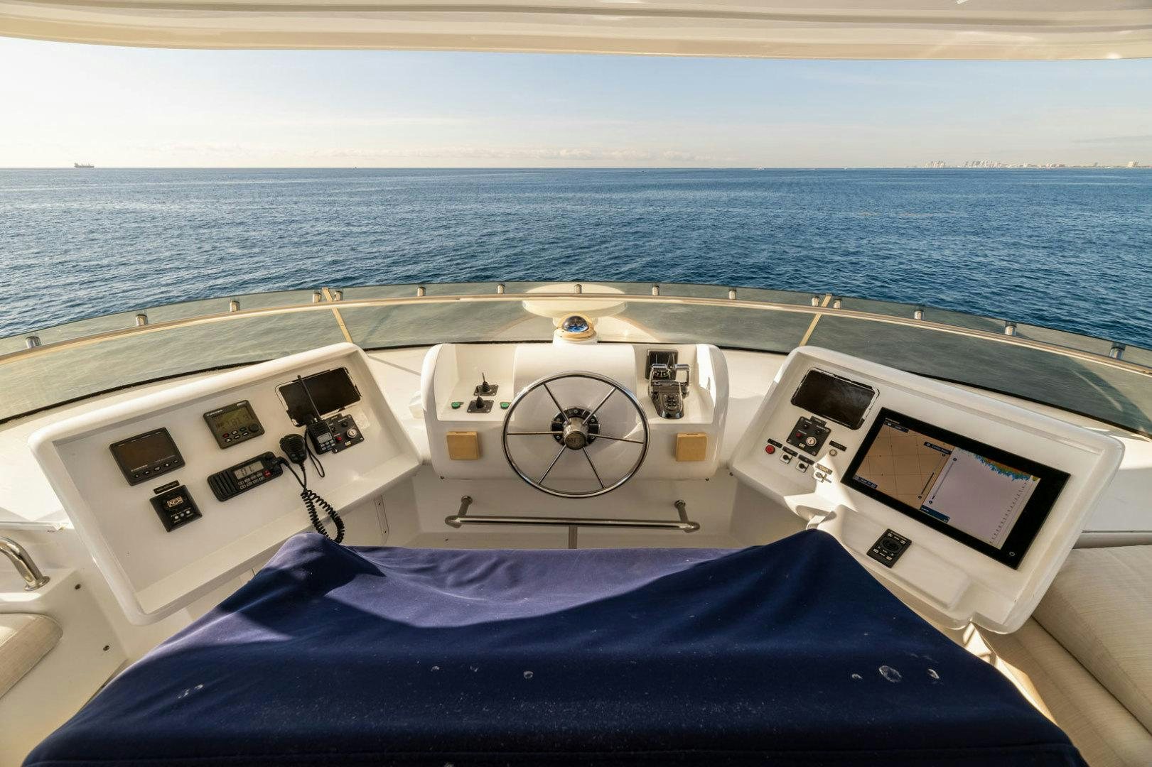 a boat with a steering wheel aboard BERADA Yacht for Sale