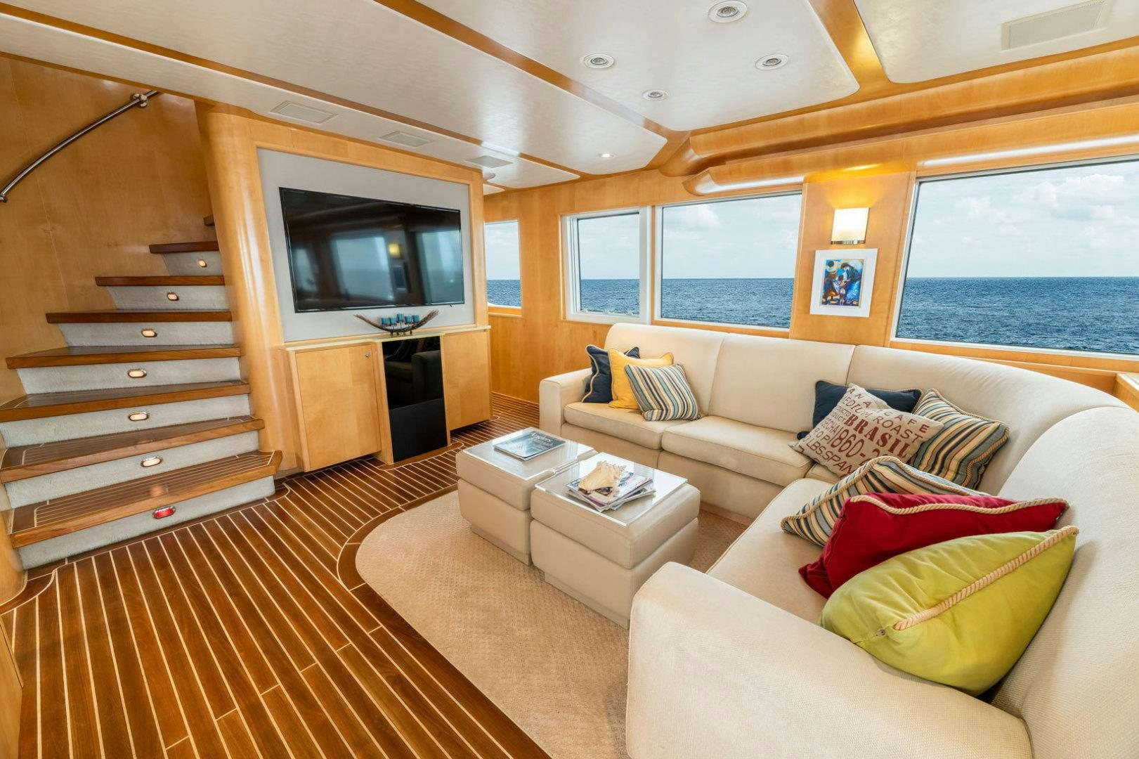 a living room with a large window aboard BERADA Yacht for Sale