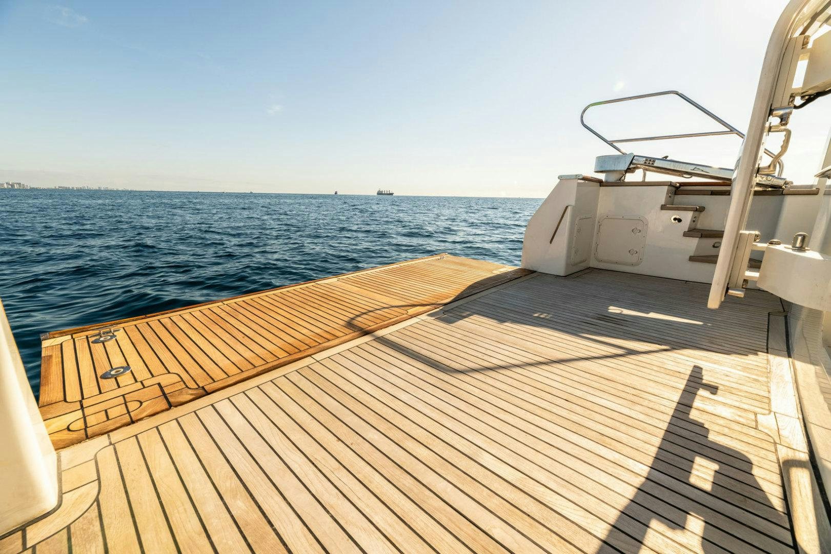 a deck with a boat on it aboard BERADA Yacht for Sale