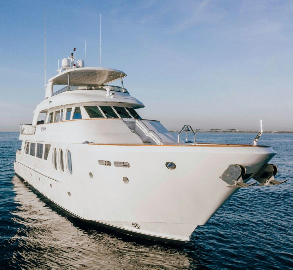 a white boat on the water aboard BERADA Yacht for Sale