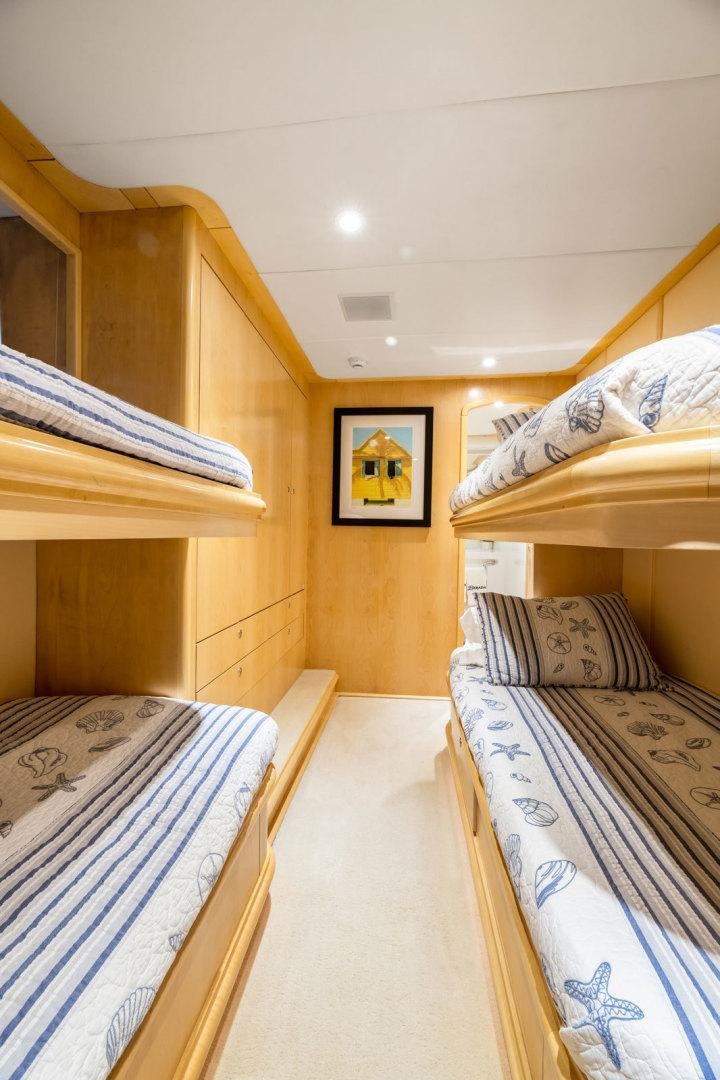 a couple of beds in a room aboard BERADA Yacht for Sale