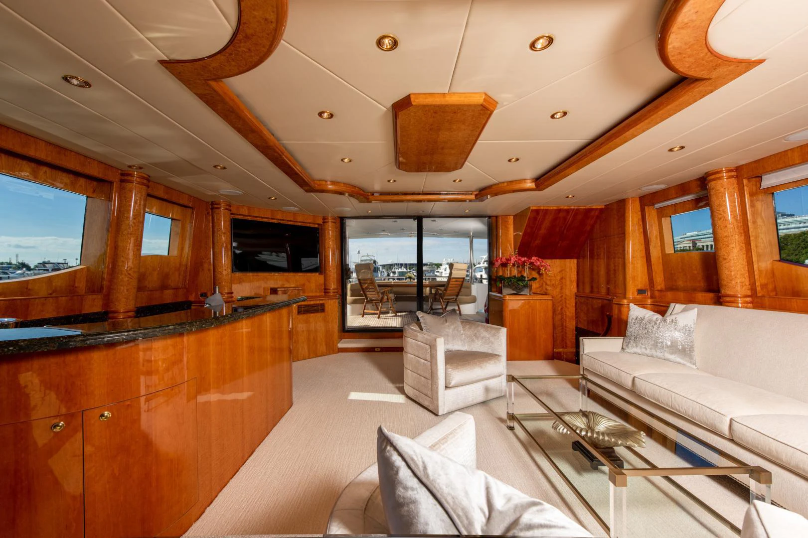 a room with a couch and a television aboard TRITON Yacht for Sale