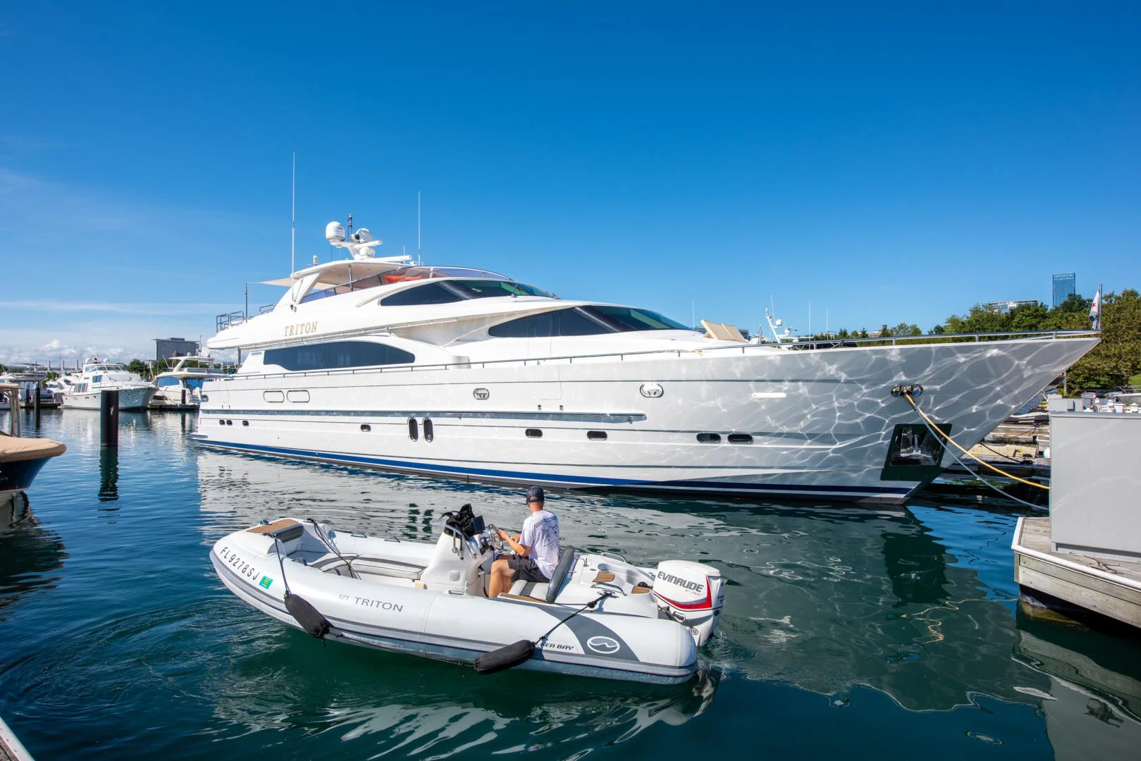 a boat docked at a pier aboard TRITON Yacht for Sale