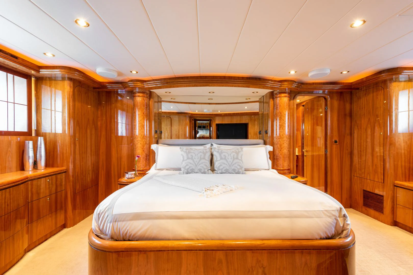 a large bed in a wooden cabin aboard TRITON Yacht for Sale