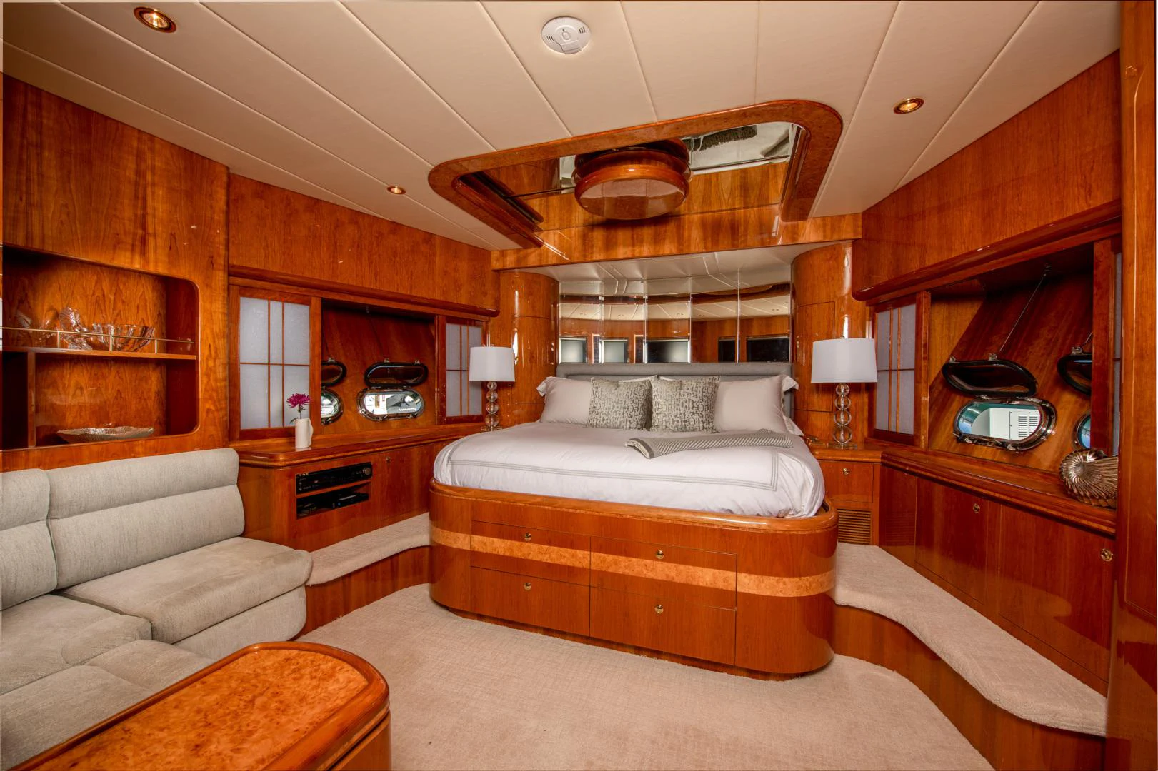 a bedroom with a bed and a couch aboard TRITON Yacht for Sale