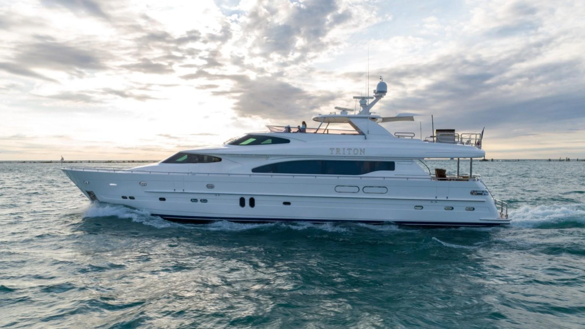 a white yacht in the water aboard TRITON Yacht for Sale