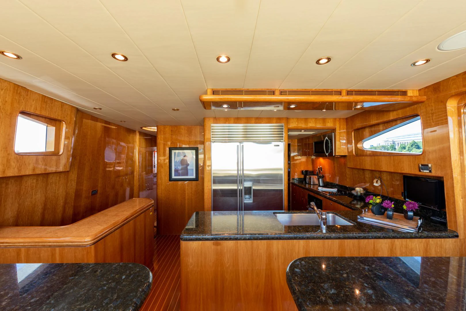 a kitchen with a large island aboard TRITON Yacht for Sale