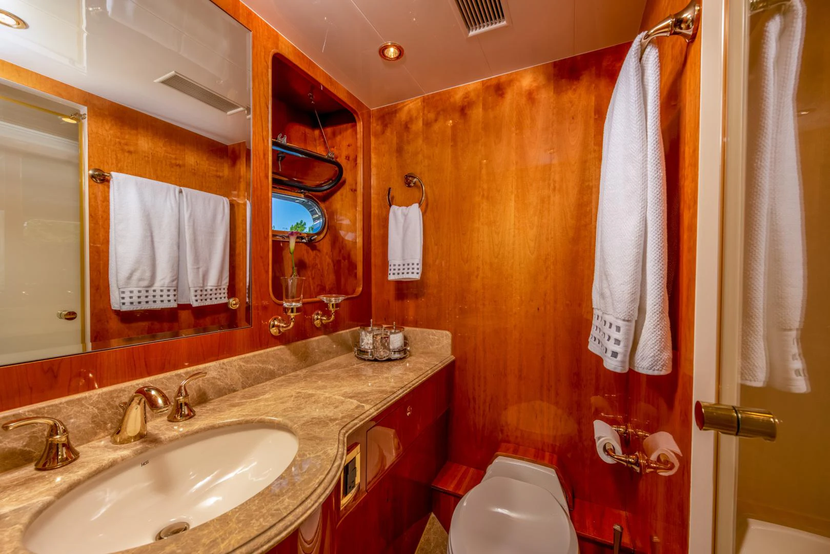 a bathroom with a sink and a toilet aboard TRITON Yacht for Sale