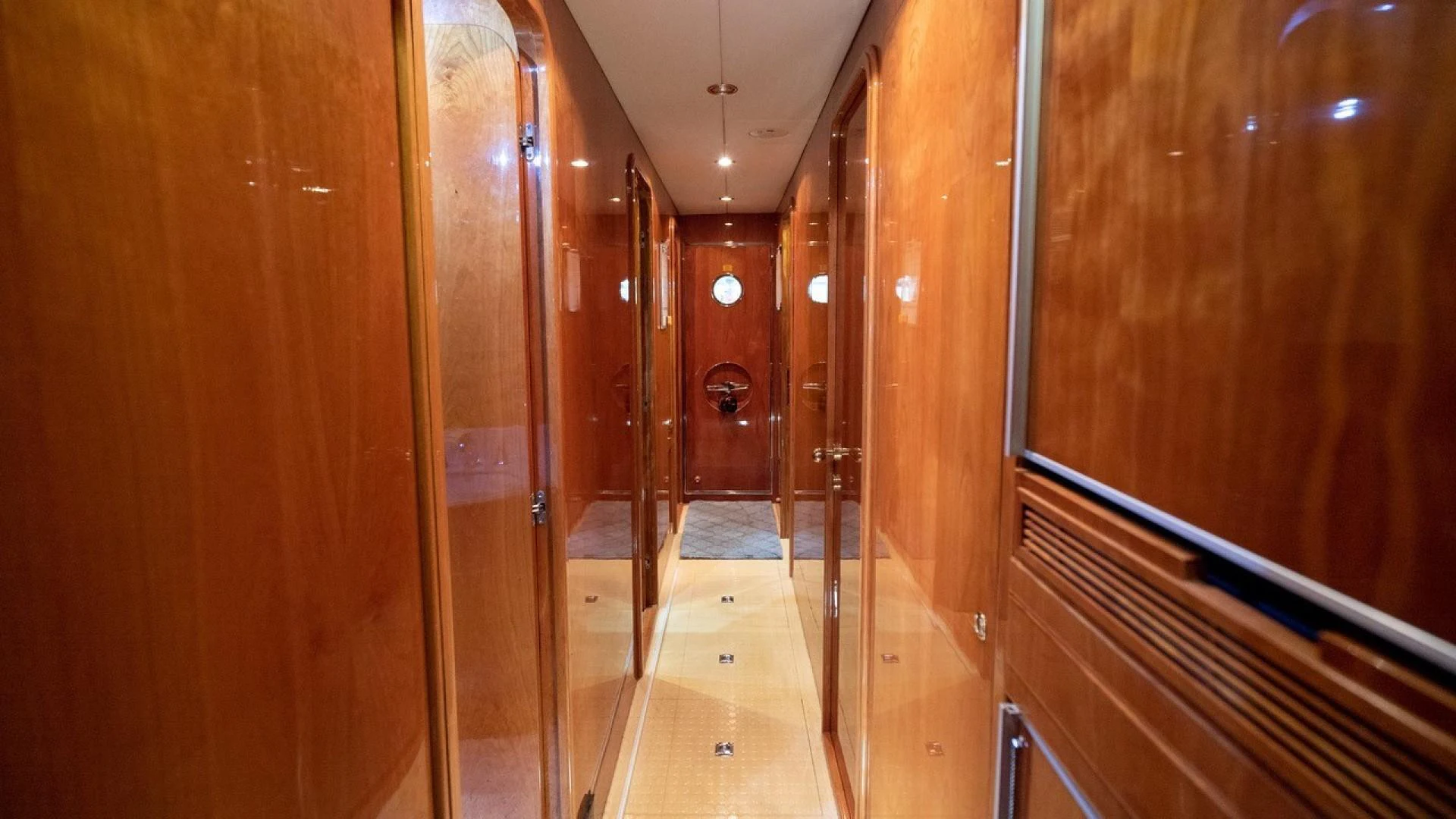 a hallway with wooden doors aboard TRITON Yacht for Sale